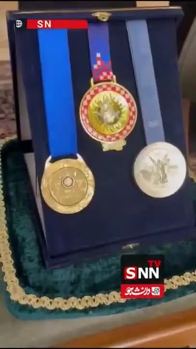 ببینید| قهرمانان کشتی مدال‌هایشان را به موزه آستان قدس اهدا کردند
